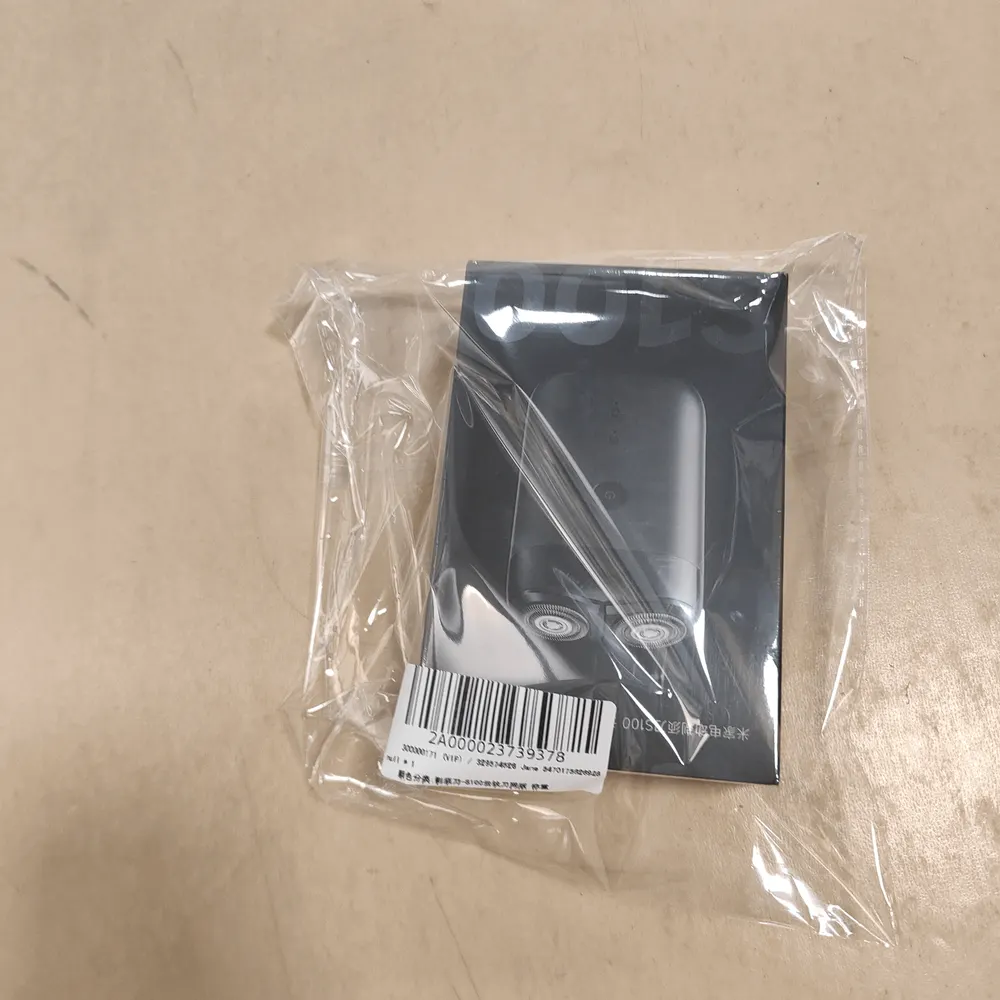 QC-Foto: verpackter Rasierer